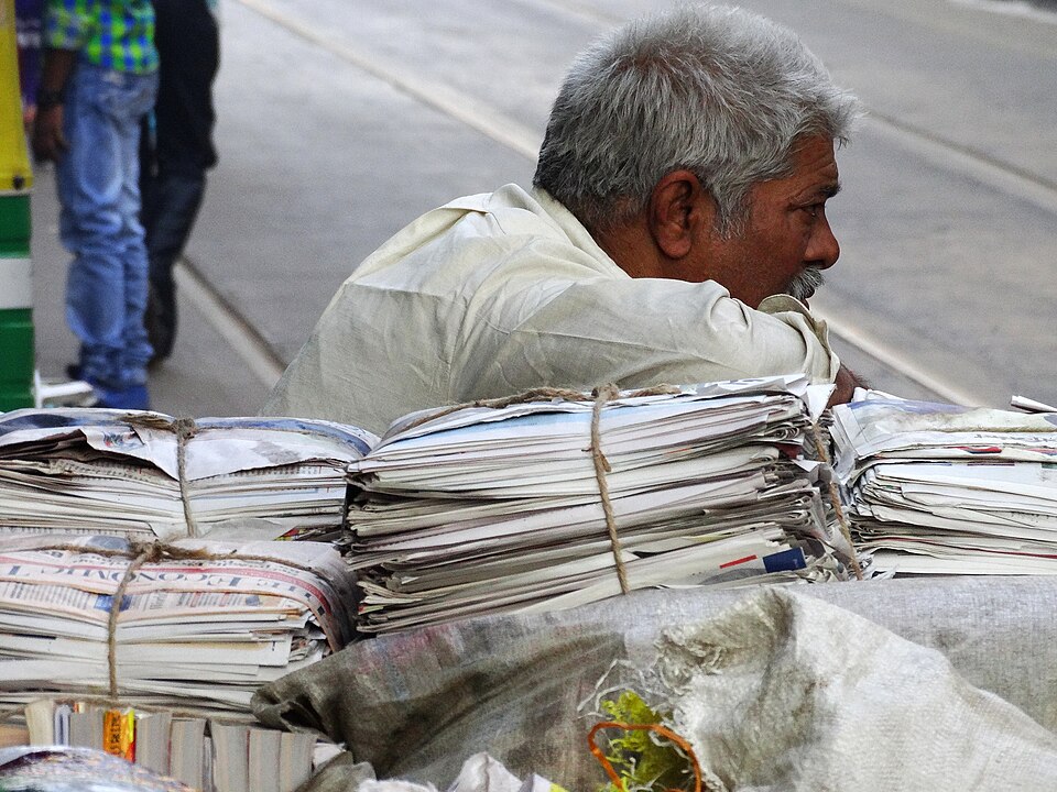 File:Man with Bundled Newspapers - BBD Bagh District - Kolkata - India (12304056183).jpg